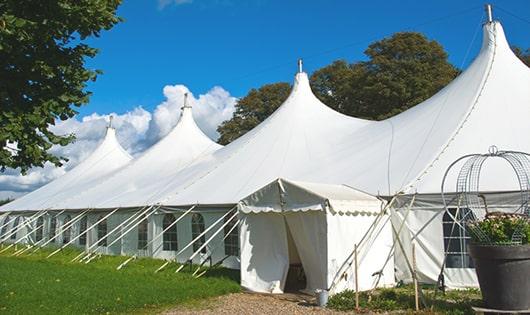 a line of sleek and modern portable toilets ready for use at an upscale corporate event in Fairdale